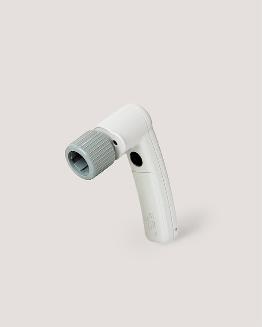 White Electric Matcha Whisk Gun with grey attachment, premium tool for matcha lattes and tea rituals.
