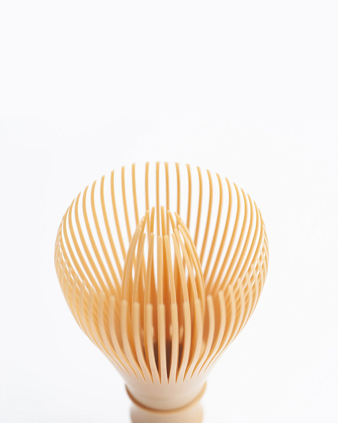 Close-up of resin matcha whisk head, 55-tine chasen designed for smooth froth in matcha tea and lattes.
